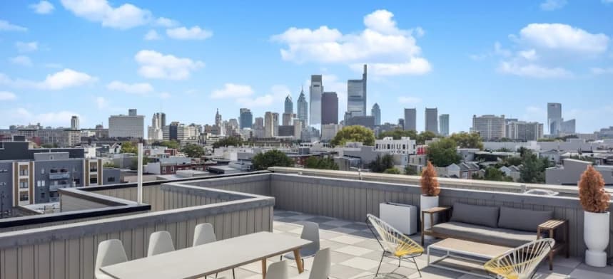 Rooftop terrace with city skyline virtual staging example - Pixel Perfects Solutions LLC